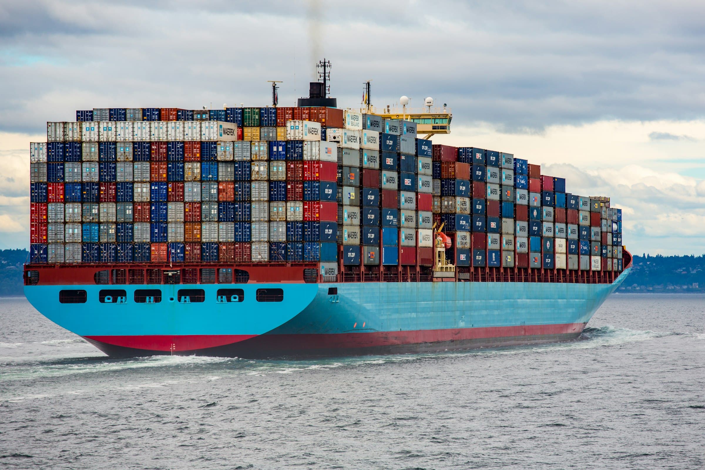 A laden cargo vessel underway at sea